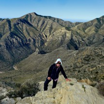 Marion on top of 2550 meters high Hunter Peak with Guadalupe Peak in the background